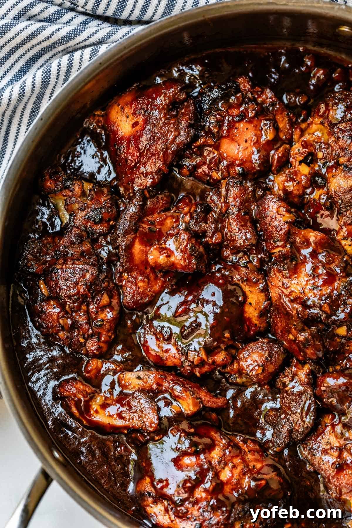 Easy Honey Garlic Chicken Slow Cooker Instant Pot 7 full batch of honey garlic chicken cooked stovetop in a metal skillet.