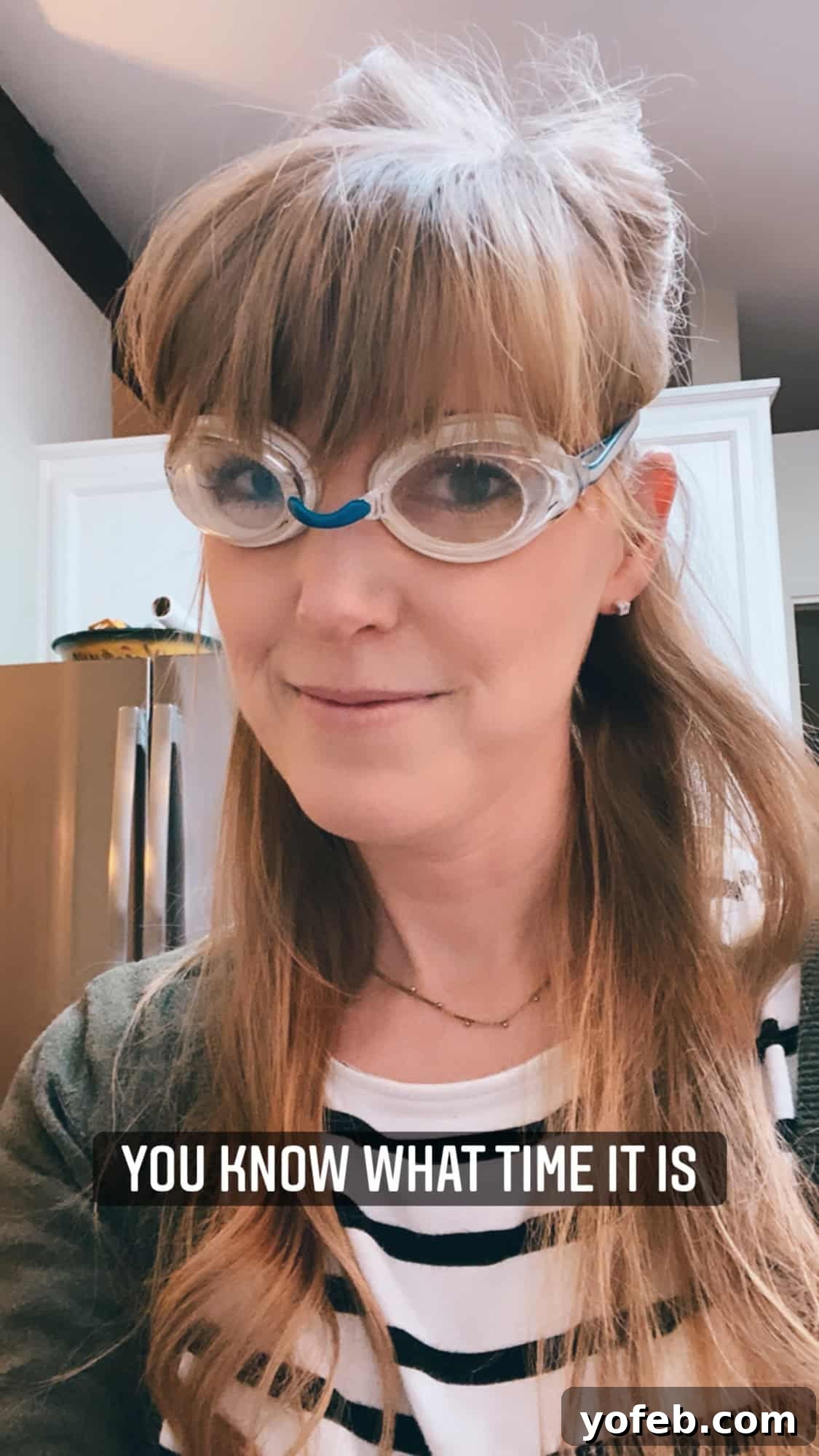 Chop Onions Like a Pro 4 woman wearing swim goggles in a kitchen.
