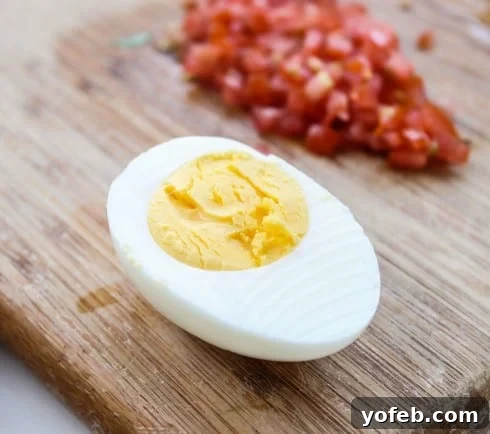 Steamed hard-boiled egg cut in half, revealing a perfectly cooked yolk