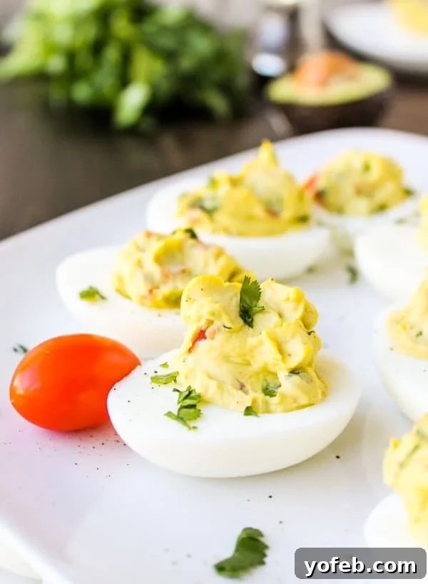 Deviled Guacamole Eggs from TheFoodCharlatan.com