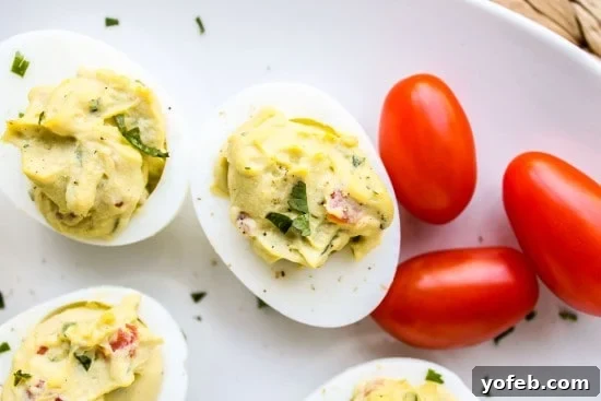 A cutting board with perfectly peeled hard-boiled eggs