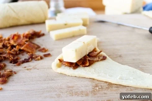 Spicy Bacon and Pepper Jack Crescent Rolls 13 Adding cheese on top of bacon in crescent dough