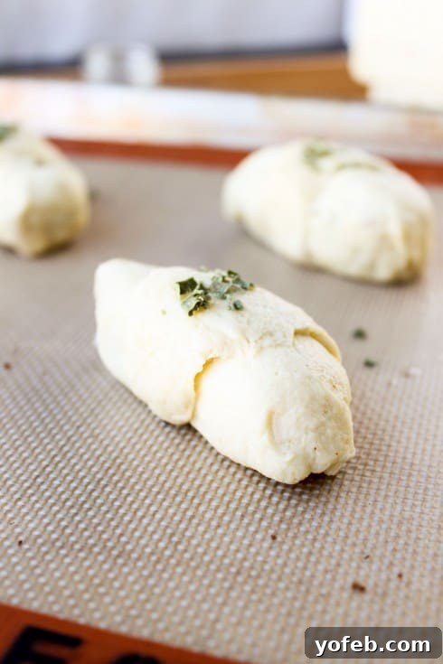 Spicy Bacon and Pepper Jack Crescent Rolls 15 Sealing the edges of a stuffed crescent roll