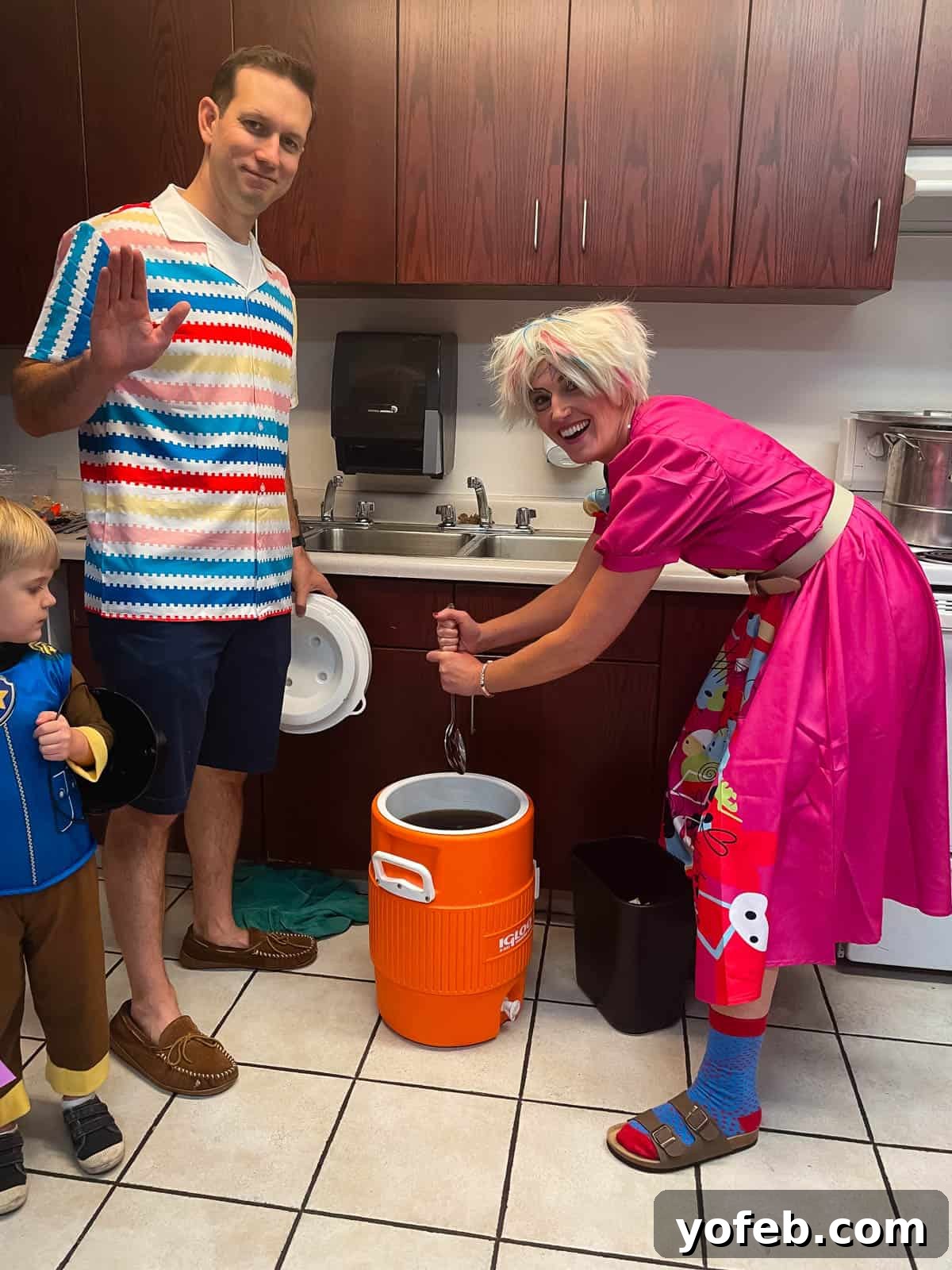 Irresistible White Chocolate Brownies 3 Woman dressed as weird barbie stirring a 5-gallon jug at a Halloween event, embodying a fun and festive spirit.