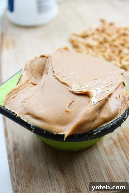 Ultimate Snickers Brownie Treat 13 Peanut butter being mixed with marshmallow creme for the nougat layer