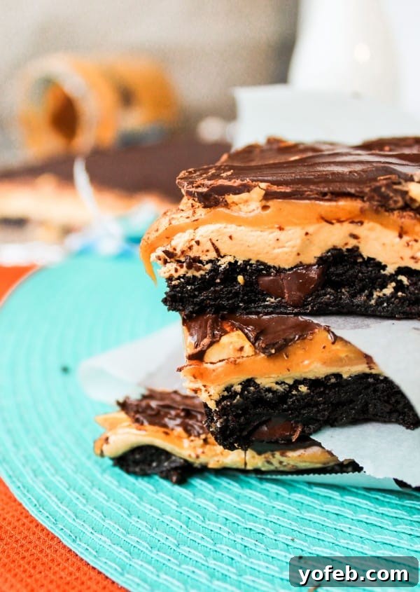 Ultimate Snickers Brownie Treat 3 Close-up of Snickers Brownie Bars showing the chewy caramel and peanut layer