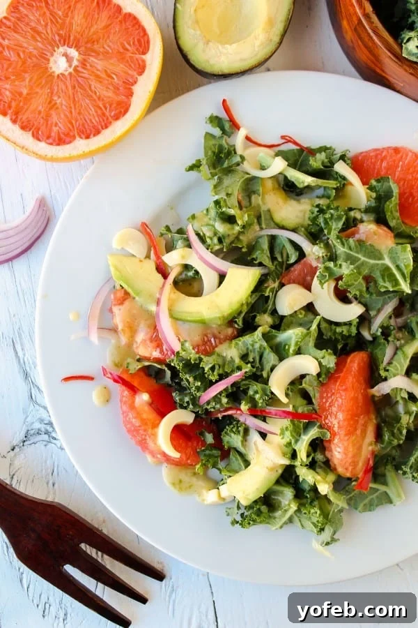 Zesty Avocado & Ruby Grapefruit Medley 2 Refreshing Avocado and Grapefruit Salad on a white plate, showcasing vibrant colors and fresh ingredients