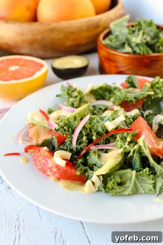 Zesty Avocado & Ruby Grapefruit Medley 5 A beautifully composed kale and grapefruit salad with other fresh ingredients in the background, highlighting its freshness