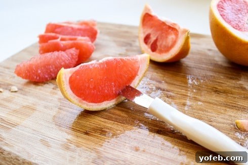 Step-by-step image showing how to slice the peel from a grapefruit for a salad