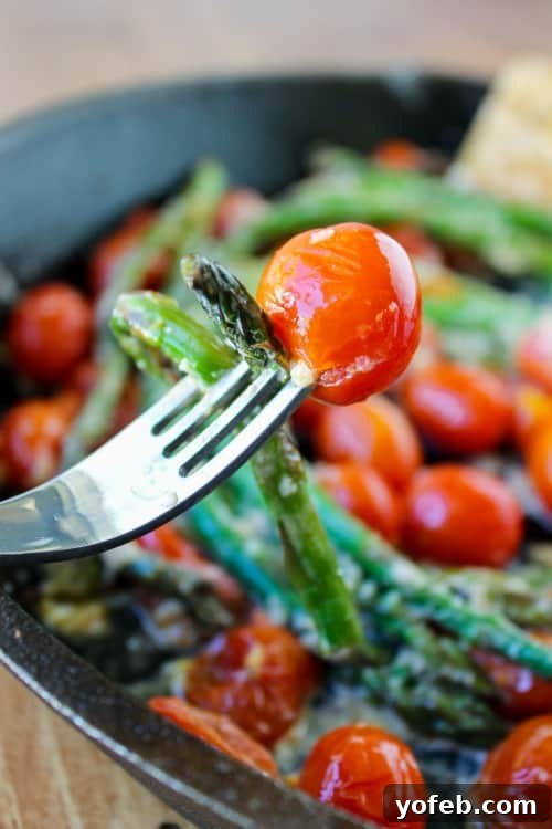 Crisp Asparagus and Tomato Medley 10 A fork lifts a perfect mouthful of sautéed asparagus and cherry tomatoes, highlighting the dish's irresistible appeal.