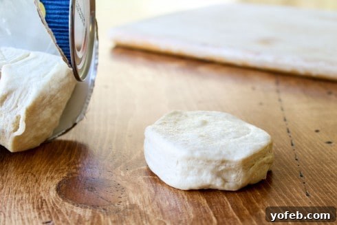 Simple 30-Minute Maple Bars 11 Separating biscuit dough pieces for maple bars