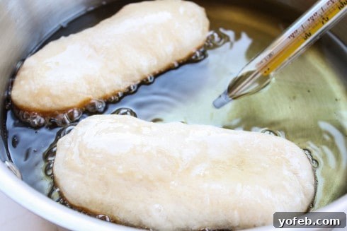 Simple 30-Minute Maple Bars 14 Biscuit dough dropped into hot oil for frying