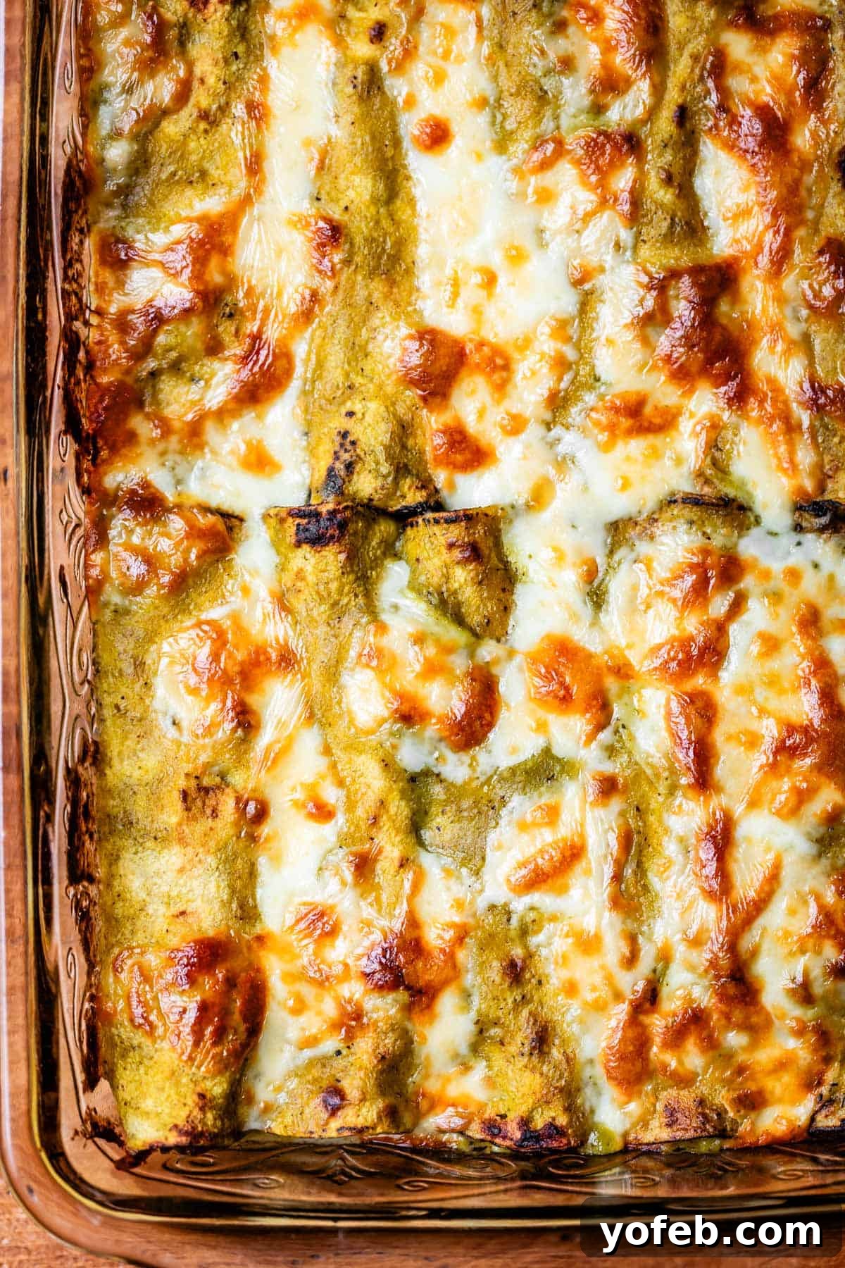 Yeni Gözdem Tavuk Enchilada 2 looking down at a glass casserole dish of baked green chicken enchiladas,