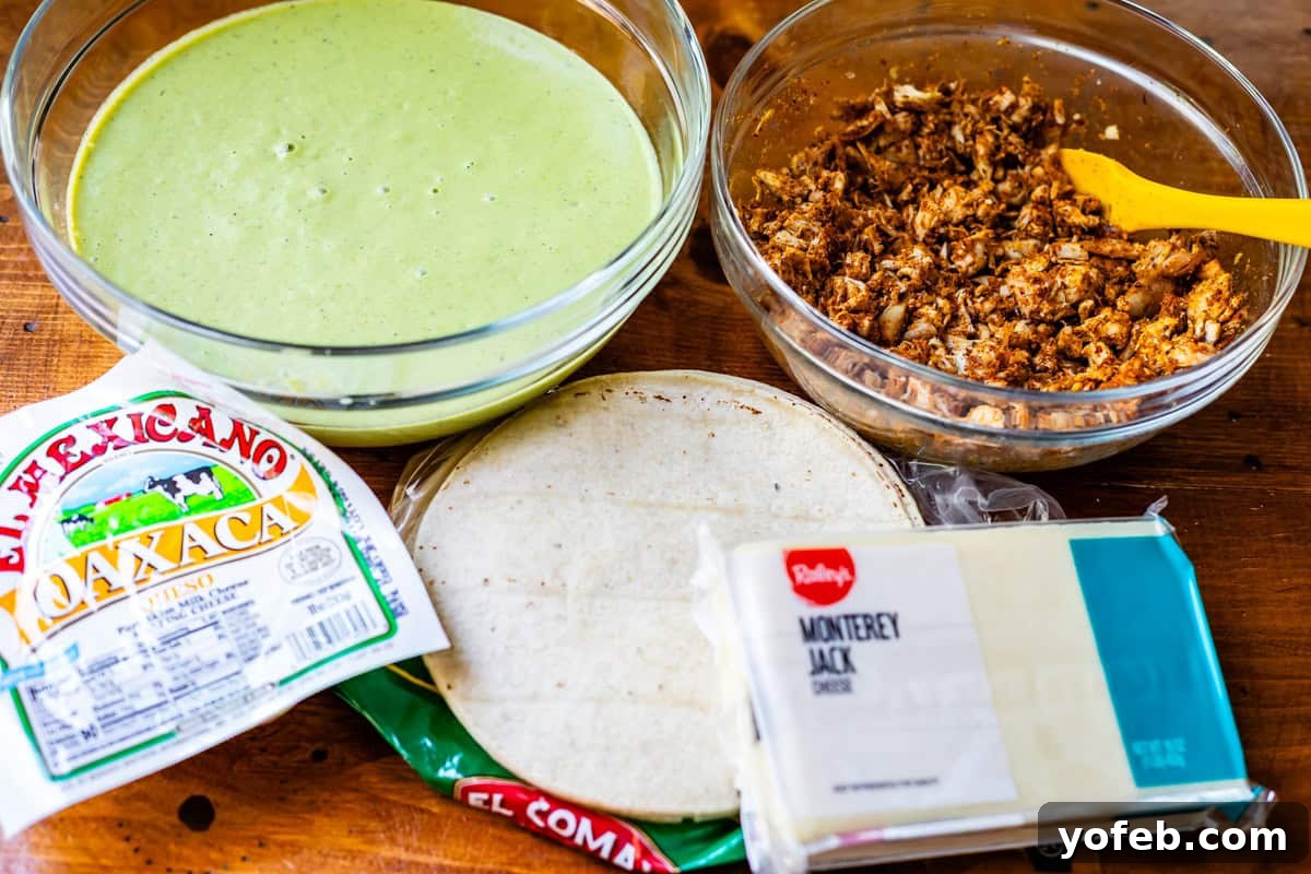 Yeni Gözdem Tavuk Enchilada 7 bowl of green enchilada sauce, bowl of seasoned chicken, tortillas, and cheese on a table.
