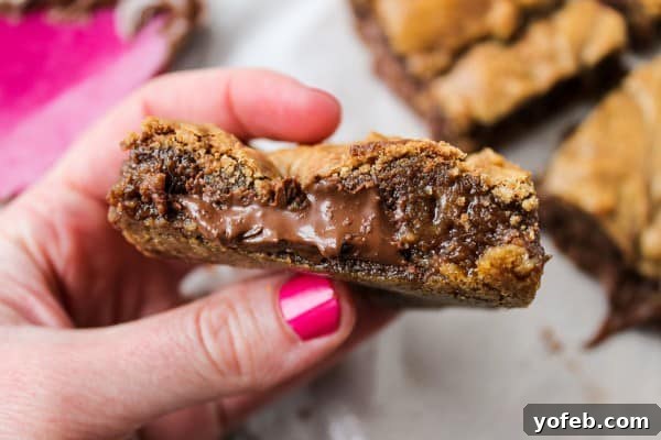 Decadent Browned Butter Blondies with a Gooey Nutella Heart 9 A close-up of blondie batter with streaks of Nutella swirled in, ready for baking.