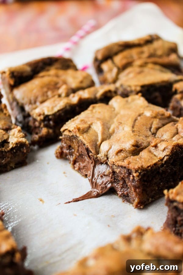 Nutella-Stuffed Browned Butter Blondies: A delectable dessert featuring a rich, chewy blondie base with pockets of melted Nutella.