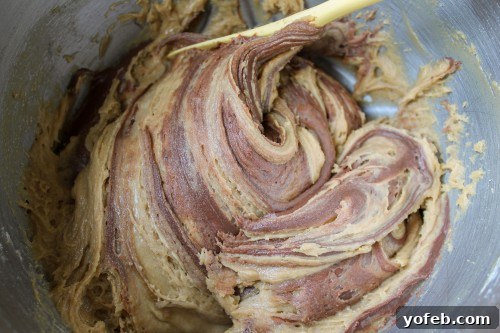 A closer look at the Nutella swirls in the blondie batter before baking, illustrating the technique.