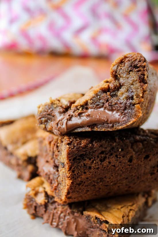 Decadent Browned Butter Blondies with a Gooey Nutella Heart 6 A batch of freshly baked Nutella-stuffed browned butter blondies, showcasing their golden crust and enticing texture.