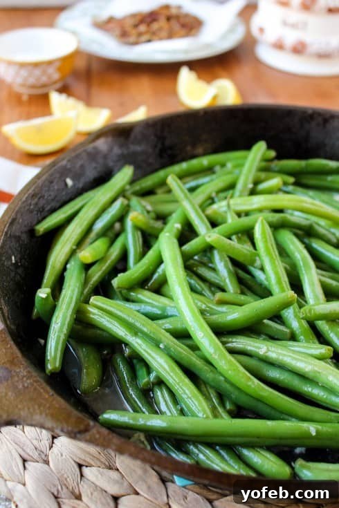 Perfectly crisp-tender green beans, bright green and vibrant after blanching and sautéing.