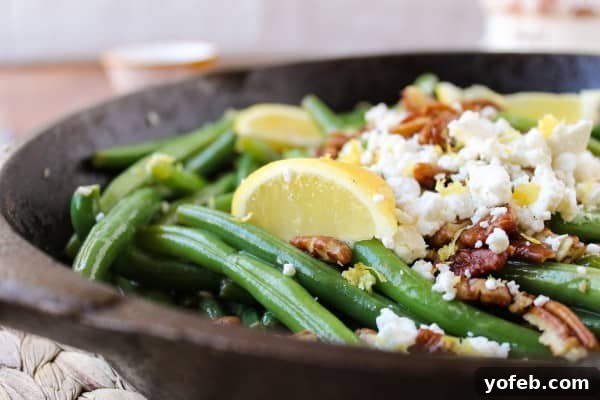 Zesty Green Beans with Creamy Feta and Crispy Pecans 4 A plate overflowing with green beans, illustrating the college anecdote.