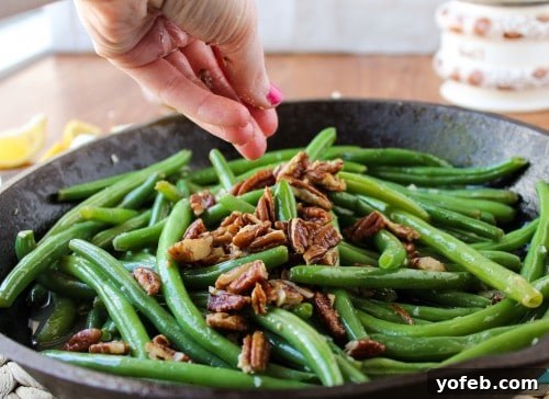Zesty Green Beans with Creamy Feta and Crispy Pecans 5 Green beans in a large serving bowl, ready for a feast.