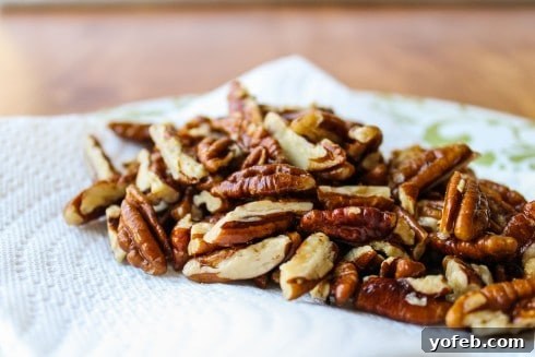 Zesty Green Beans with Creamy Feta and Crispy Pecans 6 Close-up of golden-brown fried pecans, a key ingredient for adding crunch.