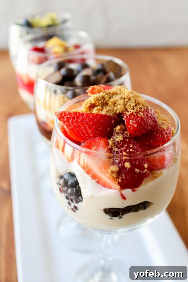 Effortless Cheesecake Parfait Station 19 A beautifully layered no-bake cheesecake parfait with fresh berries, showcasing its elegant appeal