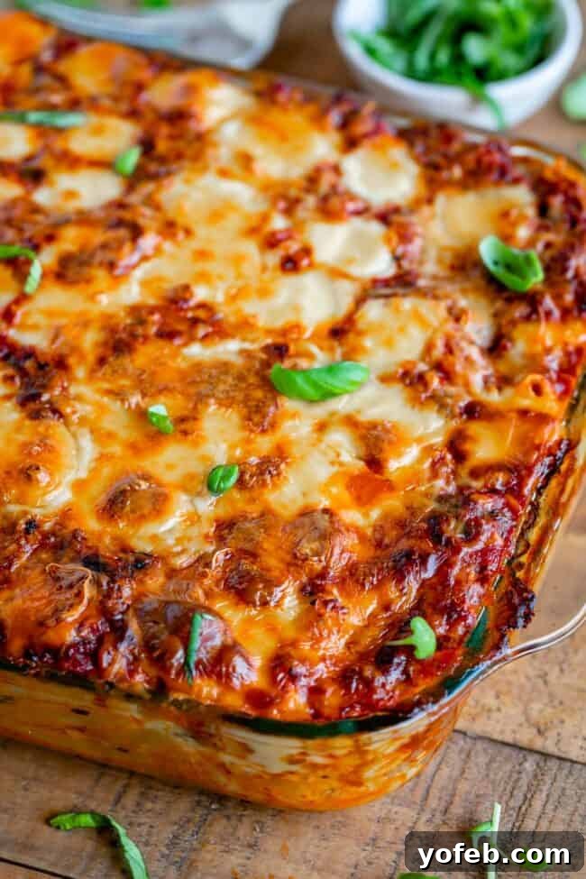 Fresh Basil Garnish on Top of Baked Ziti. Cheesy baked ziti with fresh basil on top, ready to be served.