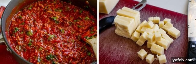 Homemade Marinara and Diced Mozzarella. A pan of rich red marinara sauce, with cubed mozzarella ready on a cutting board.