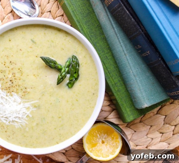 Vibrant Spring Asparagus Puree 9 A comforting bowl of creamy asparagus soup beside a stack of books, perfect for a cozy moment.