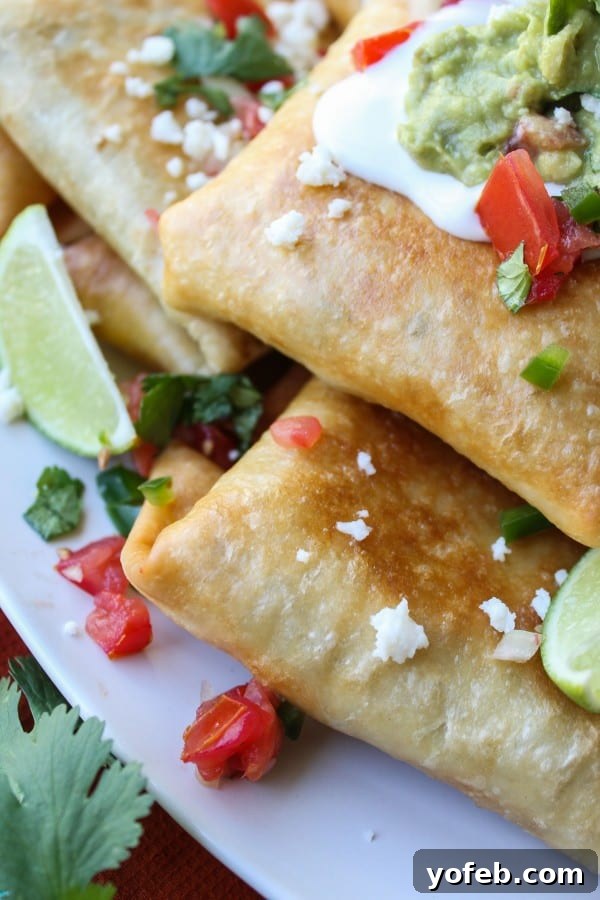 Tangy Tomatillo Chipotle Chicken Chimichangas 3 Close-up of golden-fried Chicken, Tomatillo, and Chipotle Chimichangas, ready to serve