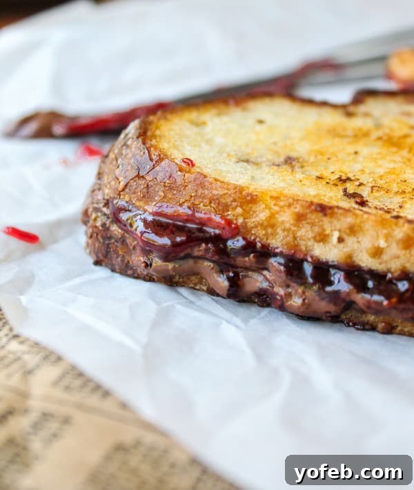 Pile of Raspberry Nocciolata Grilled Sandwiches, sliced and ready to eat