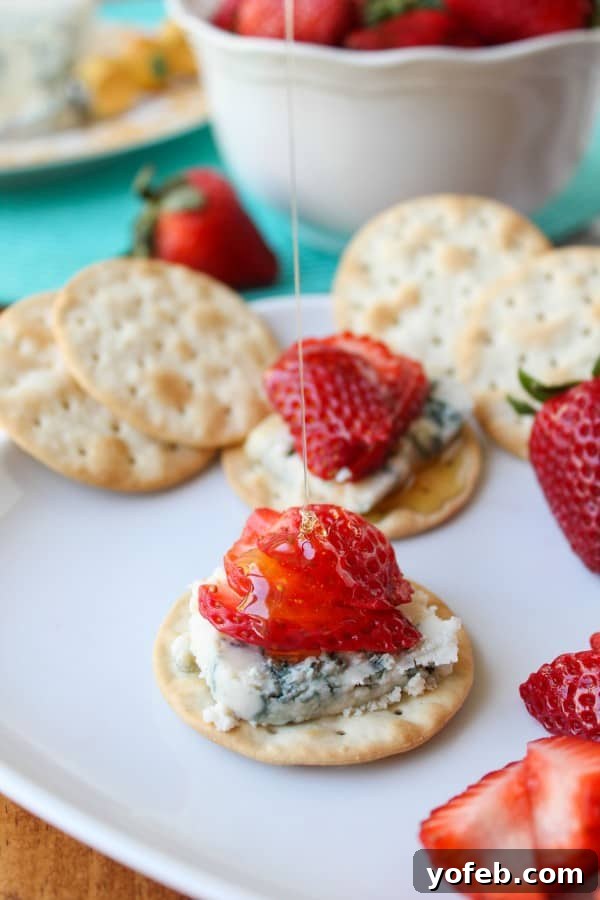Honey-Drizzled Bleu Cheese Strawberry Jewels 6 A perfectly assembled Honey-Drizzled Bleu Cheese Strawberry Bite, ready to be enjoyed.