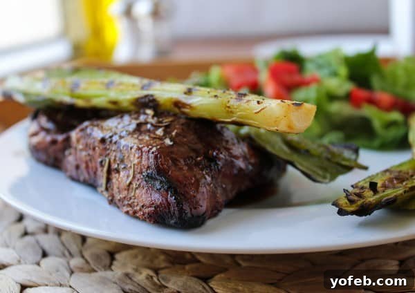 Grilled Leeks Paired with a Perfectly Cooked Ribeye Steak