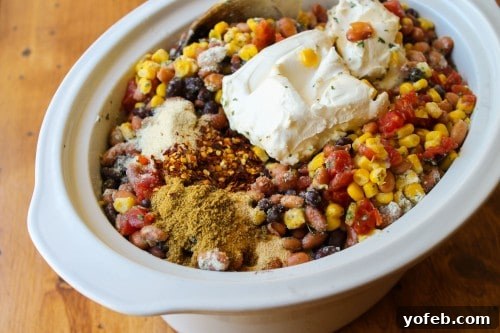 A fully loaded crockpot for Cream Cheese Chicken Chili