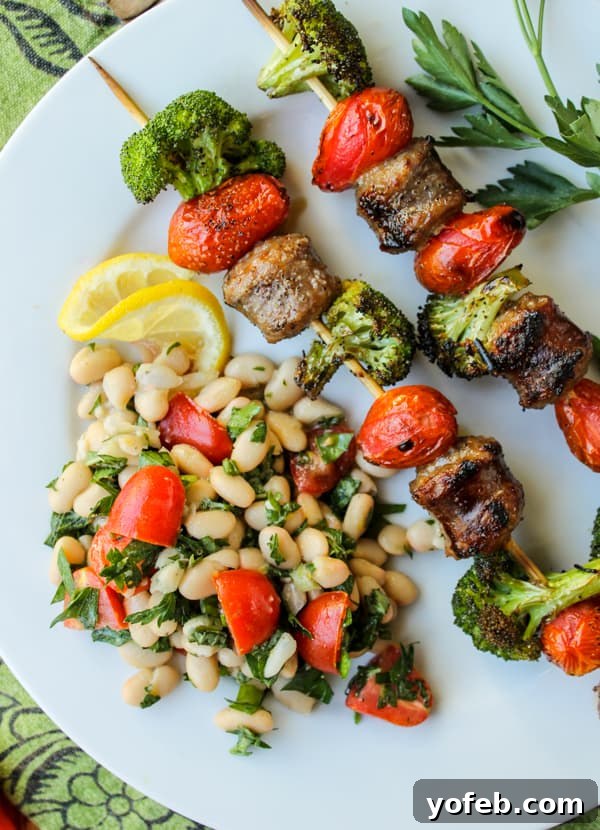 Quick Sausage & Broccoli Skewers with Zesty White Bean Salad 6 Plated Sausage and Broccoli Kebabs with White Bean Salad, ready to serve