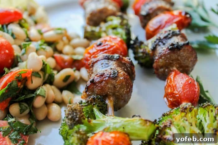 Quick Sausage & Broccoli Skewers with Zesty White Bean Salad 7 Sausage and Broccoli Kebabs grilling on an outdoor grill