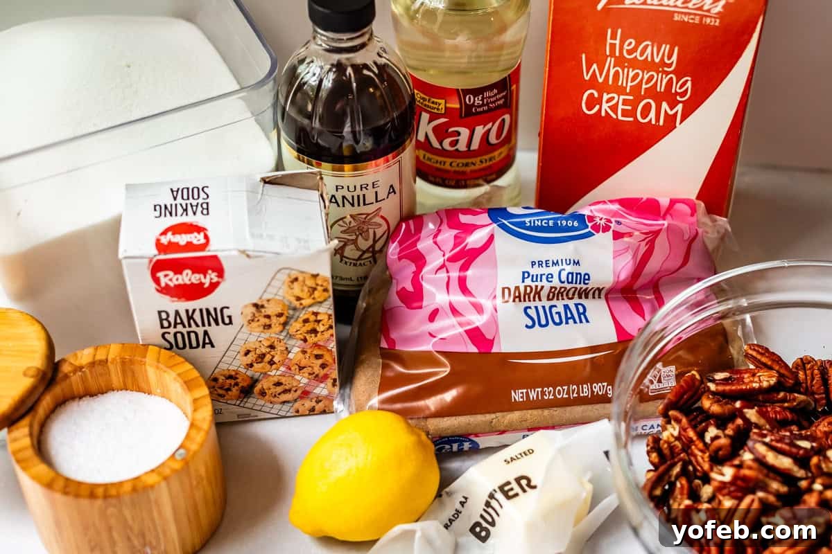 Buttery Pecan Bliss 7 Various baking ingredients are arranged on a counter, including brown sugar, heavy whipping cream, vanilla extract, corn syrup, baking soda, salt, a lemon, butter, pecans, and a container of white sugar.