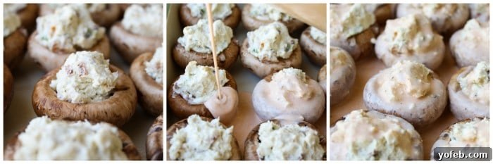 Spicy blue cheese sauce being artfully drizzled over the bacon stuffed mushrooms before they are placed in the oven.