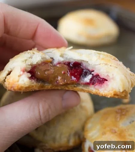 Sweet Cranberry Dulce de Leche Hand Pies 6 Close-up of Hand Pies with Flaky Crust