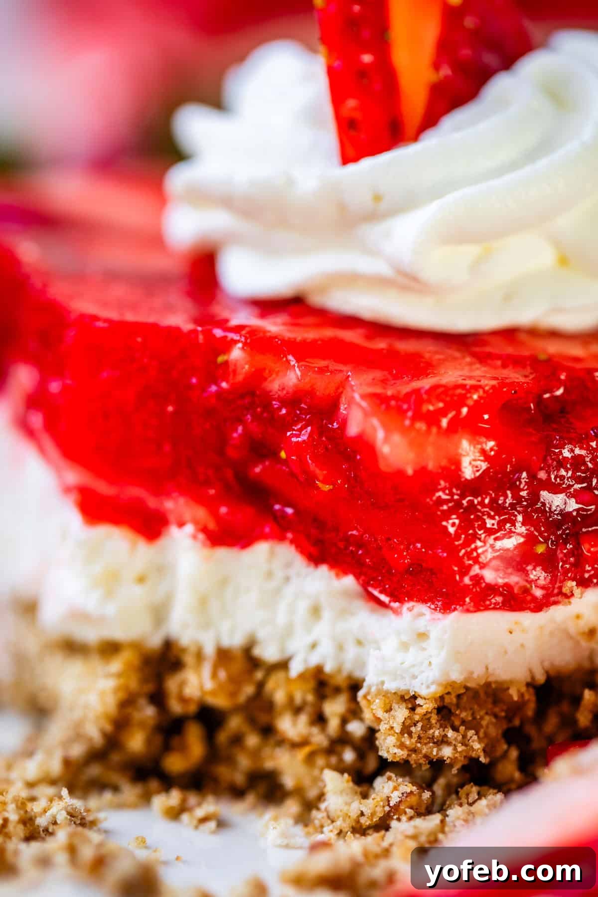 Sweet & Salty Pretzel Delight 19 strawberry jello pretzel salad shot from up close.