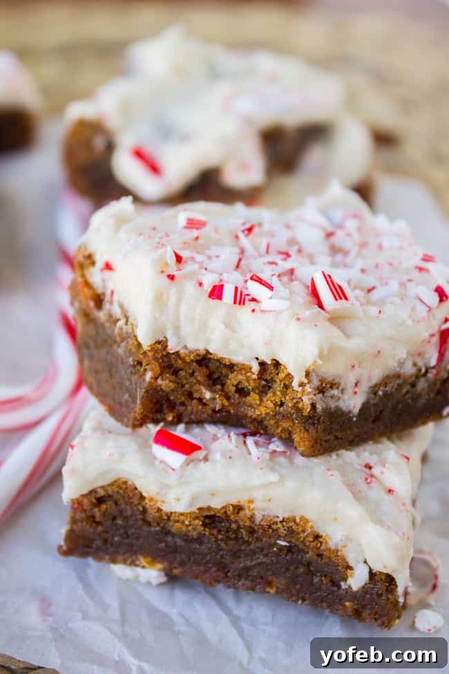 Delicious Frosted Peppermint Gingerbread Bars topped with crushed candy canes, perfect for holiday gatherings.
