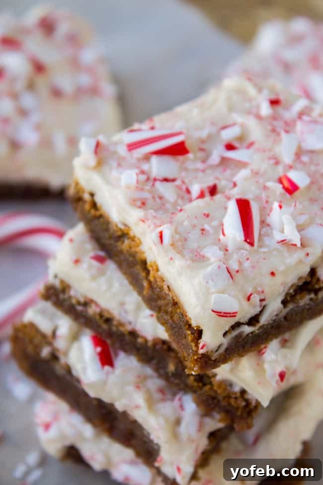 A tray of Frosted Peppermint Gingerbread Bars cooling on a wire rack, waiting for their luscious vanilla buttercream topping.