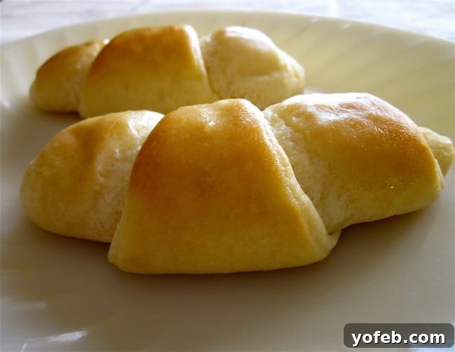 Classic Homemade Crescent Rolls An older photo of baked crescent rolls, showing the timeless quality of the recipe.