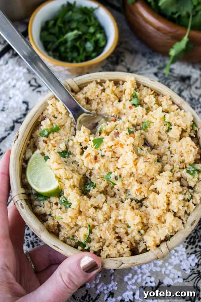 Asian Cauliflower Fried Rice 6 Serving of Asian Cauliflower Rice with a fork