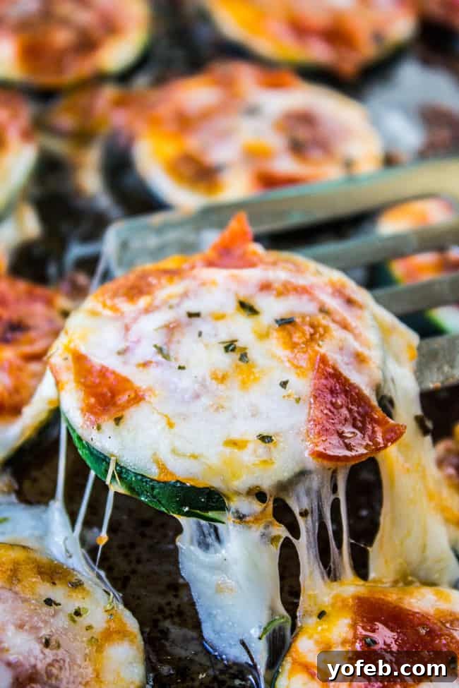 Mini Zucchini Pizzas 2 Delicious Zucchini Pizza Bites with melted cheese and pepperoni, ready to be served