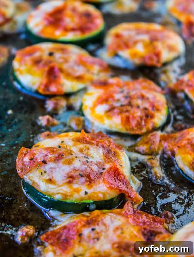 Mini Zucchini Pizzas 7 Close-up of a Zucchini Pizza Bite with melted mozzarella and pepperoni