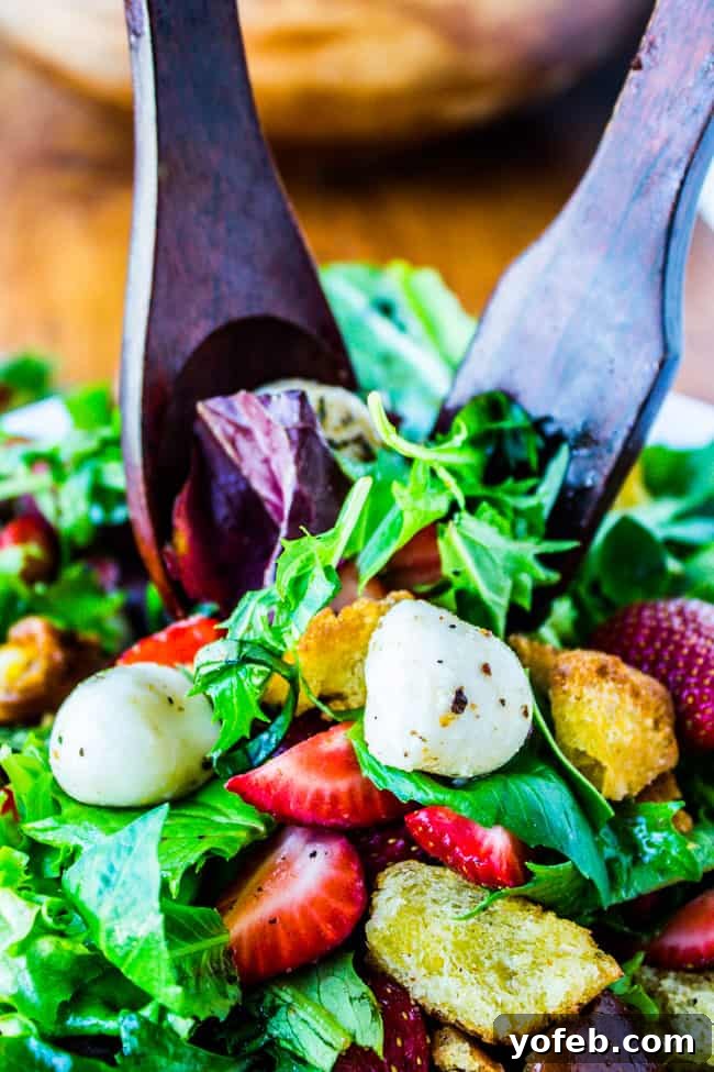 Refreshing Strawberry Panzanella 9 Platter of Strawberry Panzanella Salad showcasing fried bread, strawberries, and mozzarella