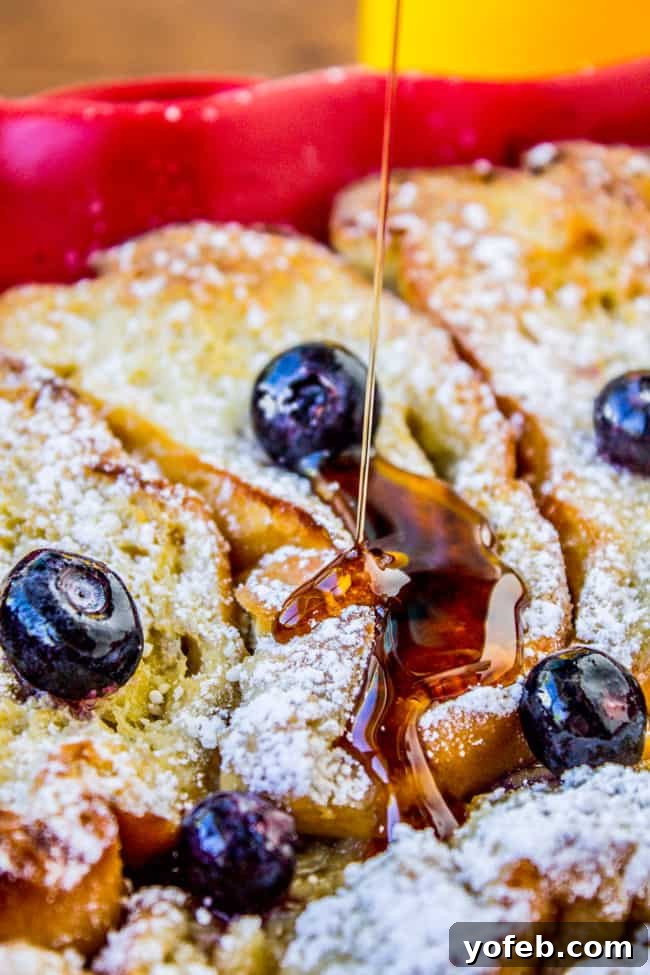 Blueberry Bliss Overnight French Toast Bake 4 Golden-brown slices of French bread ready for soaking in the casserole dish