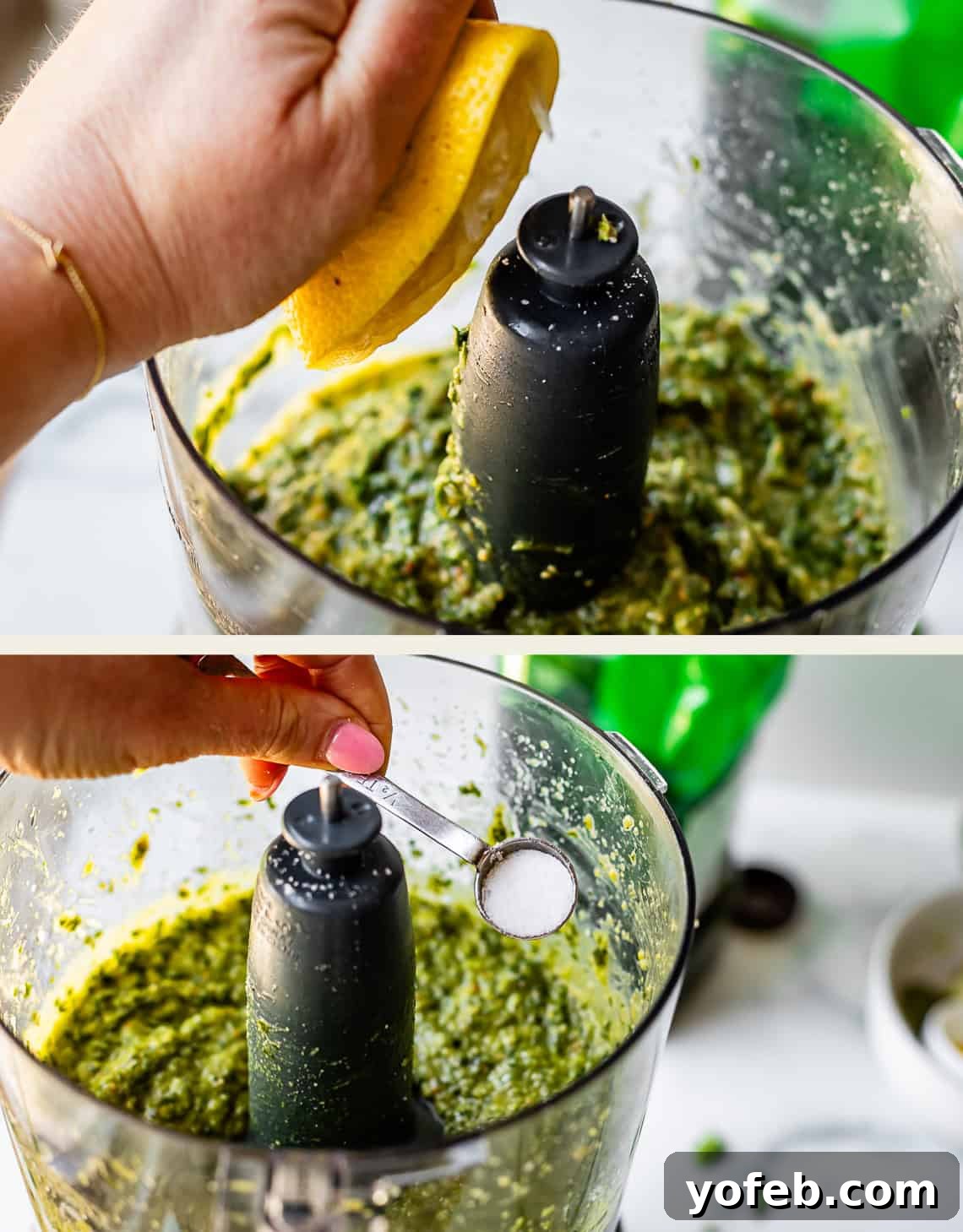 Vibrant Basil Pesto 18 A person squeezes a lemon half and adds a spoonful of salt to a green mixture in a food processor, preparing a sauce or pesto.